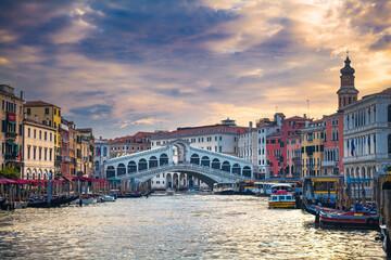 Rialto Bridge over the Grand Canal in Venice, Italy – Famous Historic Landmark and Scenic Venetian Cityscape © lokomotiv48
