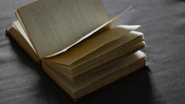 Old book pages on dark background