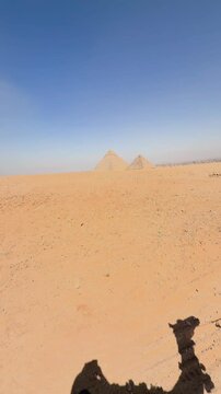 Pyramid of Khafre and The Great Pyramid in the background in Giza. Cairo, Egypt. Ancient mystical Wonders of the World