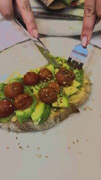 Fresh Avocado Toast with Cherry Tomatoes on a Plate