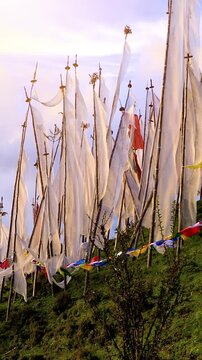 Buddhist prayer flags blowing In the wind. Shot in Bhutan.