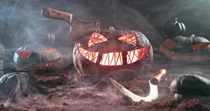 Old chopper pierce a terrifying glowing pumpkin at night.