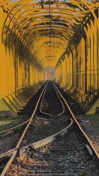 Warmly Illuminated Railway Tunnel with Curving Tracks