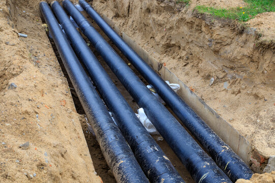 District heating main pipeline in a trench. Installation and repair of district heating networks