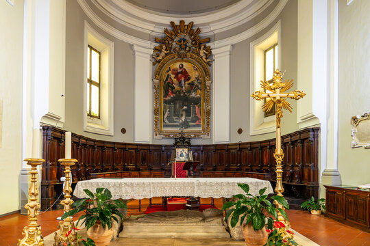 Main altar and wooden choir stalls in the apse of Saint Francis Church in Urbino