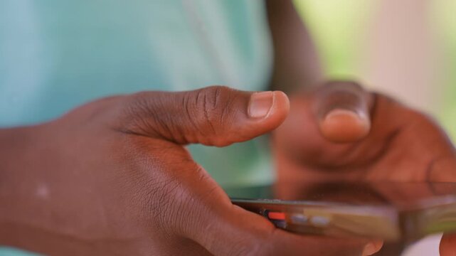 Close up view of hands interacting with mobile device focusing on skin texture and finger movement. subject fingers press or swipe touchscreen while holding phone emphasizing tactile detail