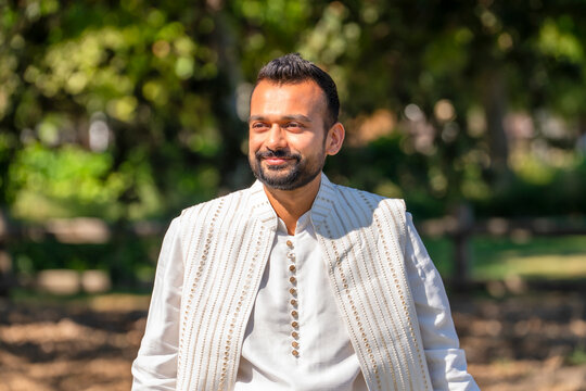 portrait indian man in white traditional outfit