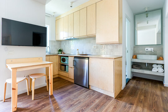 Kitchenette and bathroom share a tidy studio