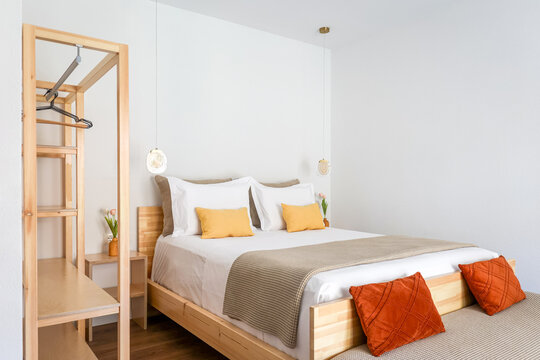 Dressed double bed in modern simple interior design