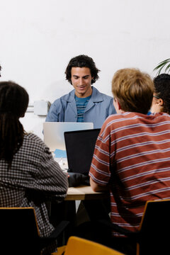 Entrepreneurs working with laptops during a collaborative meeting