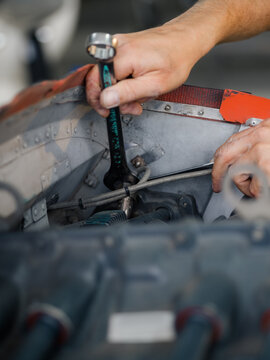 Mechanic using wrench tool