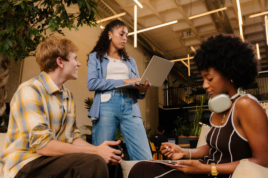 Startup founders in a collaborative meeting at a coworking space.