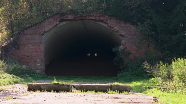 Abandoned soviet nuclear missile base. Concrete bunker entrance in a forest clearing