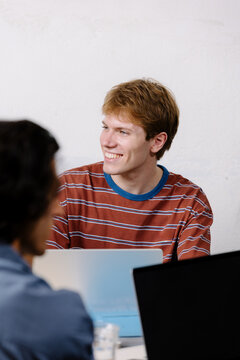 Young digital professional, using a laptop to develop projects