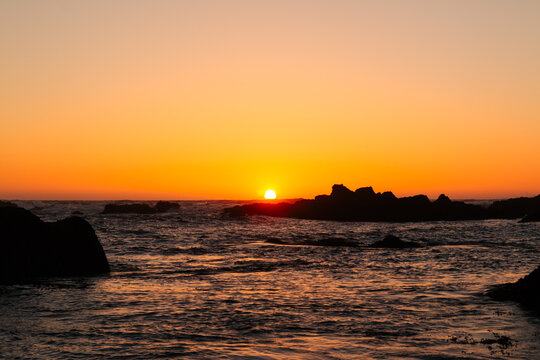 Sunset Over Rocky Coastline