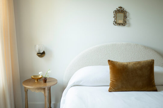 Cozy Bedroom With a Bed and Nightstand in Soft Lighting