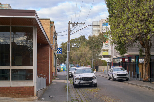 Police Cars Parked on a Street  Outside Local Police Station