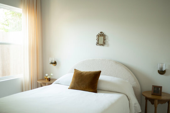 Cozy Bedroom With Light Curtains and Simple Decor
