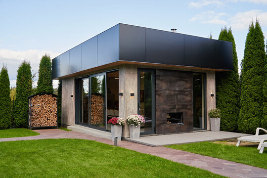 Modern prefab ADU exterior in family backyard garden