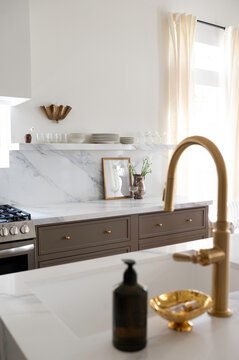 Modern Kitchen With Marble Countertops and Stylish Fixtures