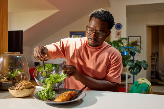 Man eats at home alone