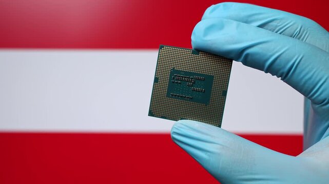 Close up view of hand in blue glove holding CPU microchip. Austrian flag in blurred background. Concept of semiconductor shortage and artificial intelligence development in Austria.