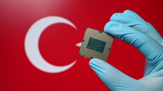 Close up view of hand in blue glove holding CPU microchip. Turkish flag in blurred background. Concept of semiconductor shortage and artificial intelligence development in Turkey.