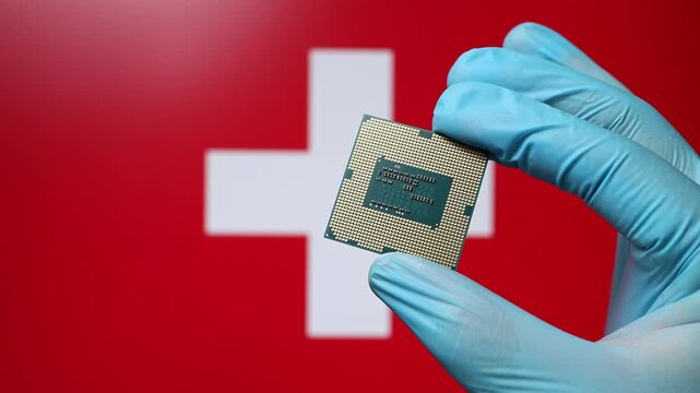 Close up view of hand in blue glove holding CPU microchip. Swiss flag in blurred background. Concept of semiconductor shortage and artificial intelligence development in Switzerland.