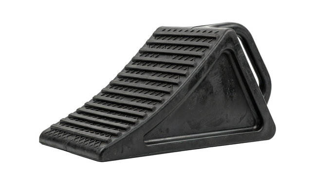 Black rubber wheel chock for vehicle stability and safety on inclines
