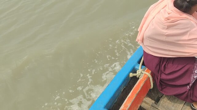 Traditional motorized passenger boat crossing the river to Mousuni Island, India