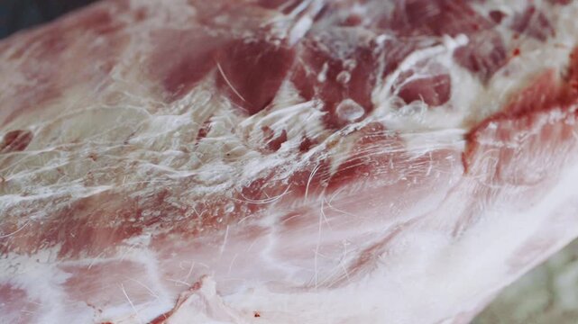 Bekasi, Indonesia, May 27 - 2026: Close-up footage of raw qurbani meat showcasing texture and detail for Eid al-Adha religious and cultural media use.