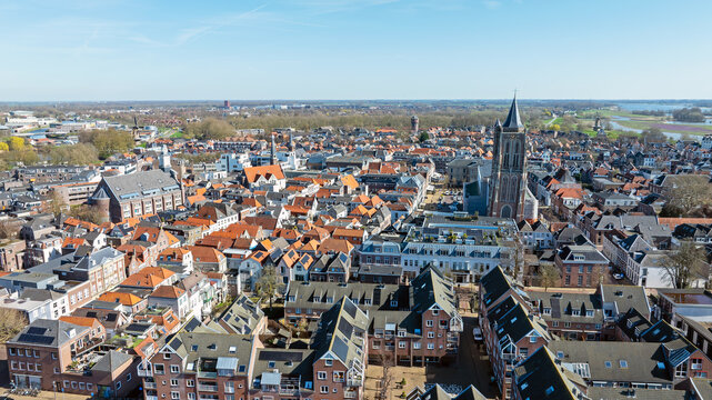 Overview of a historic Dutch city with church tower in Europe