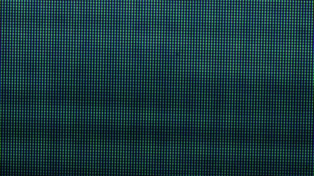 Extreme close-up video of an out-of-home digital advertising screen with individual RGB pixels and subpixels clearly visible. Nice Video Overlay via blend mode.