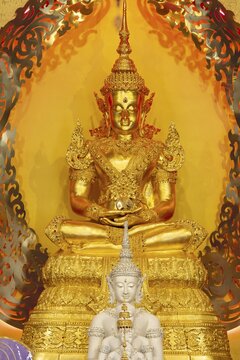 Symbolic depiction of the Buddha as an enlightened, radiant and regal figure in princely regalia, with a flame-shaped ornamental halo (aureole), at the Buddhist temple complex of Wat Phra That Sorn Kaew, Khao Kho Mountains, Phetchabun Province, Isan, Thailand
