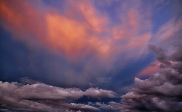 Colourful cloud atmosphere at dusk after sunset, atmospheric thunderclouds and veil clouds (cirrostratus)