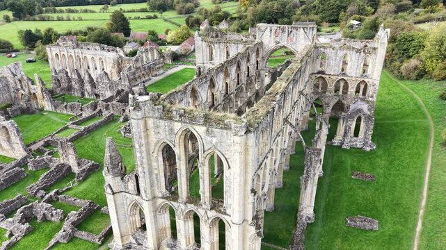 Rievaulx Abbey was a Cistercian abbey in Rievaulx, situated near Helmsley in the North York Moors National Park, North Yorkshire, England