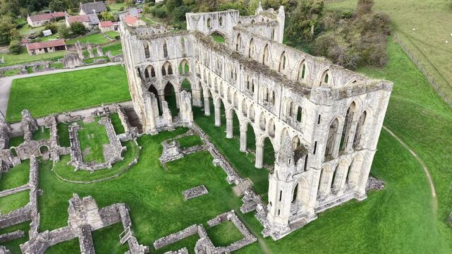 Rievaulx Abbey was a Cistercian abbey in Rievaulx, situated near Helmsley in the North York Moors National Park, North Yorkshire, England