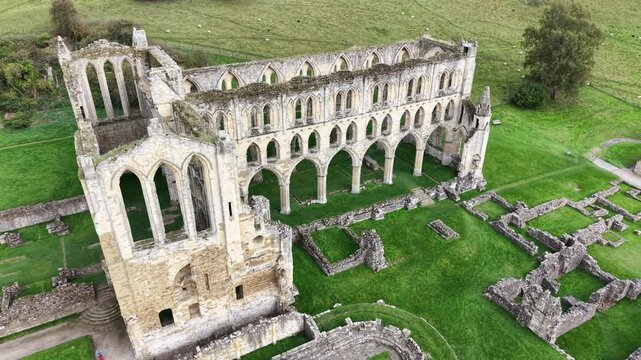 Rievaulx Abbey was a Cistercian abbey in Rievaulx, situated near Helmsley in the North York Moors National Park, North Yorkshire, England