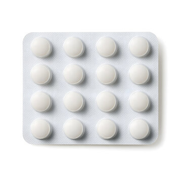A flat lay of a blister pack containing white round tablets arranged in four rows of four on a light textured background