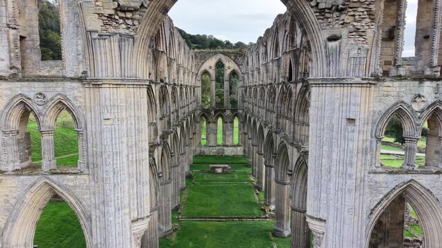 Rievaulx Abbey was a Cistercian abbey in Rievaulx, situated near Helmsley in the North York Moors National Park, North Yorkshire, England