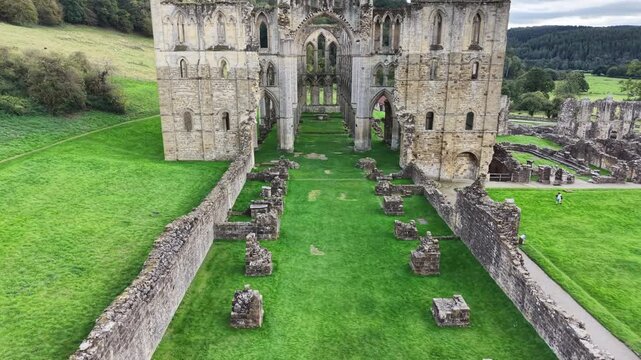 Rievaulx Abbey was a Cistercian abbey in Rievaulx, situated near Helmsley in the North York Moors National Park, North Yorkshire, England