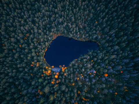 Zlate Hory, 4.10.2026, Czech Republic, Drone view of Velk&eacute; Mechov&eacute; jezero in Rejv&iacute;z Nature Reserve near Zlat&eacute; Hory, Czech Republic, surrounded by dense autumn woodland and colorful foliage