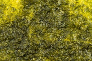 Tasty nori seaweed as a background. Top view. © Nikolay