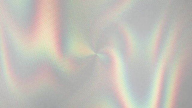 Abstract light flares with rainbow hues moving gently in a fluid wave pattern