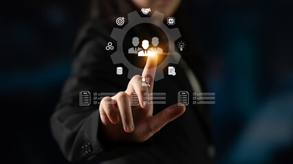 Fototapeta premium Business Professional Interacting with Digital Icons Representing Collaboration, Data, Technology, and Management Concepts in a Modern Office Environment. Glyphic.