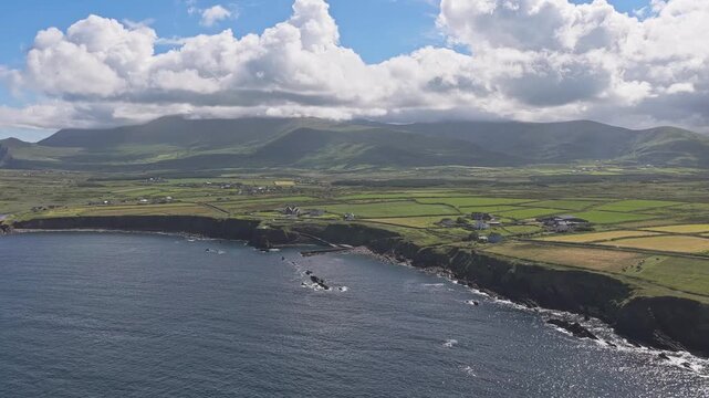 Curving Rocky Shoreline and Green Fields on the Dingle Peninsula
