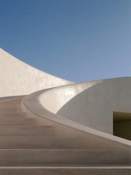 White sculptural staircase under a deep blue sky