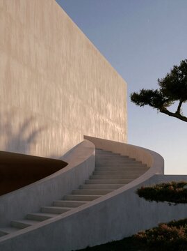 Sunlit courtyard stairs with sweeping walls and tree shadows