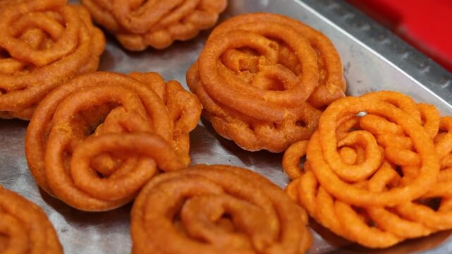 Imarti or jalebi an indian dessert fried in oil then dipped in sugar syrup