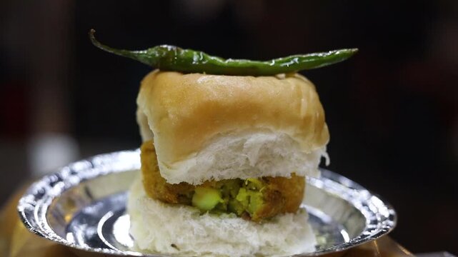 Vada pav served with green chilli 